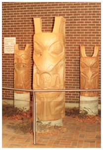 Photo of totem poles donated to TTC by Wigwamen