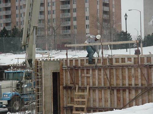 50-WorkerOnWall-02-12-04