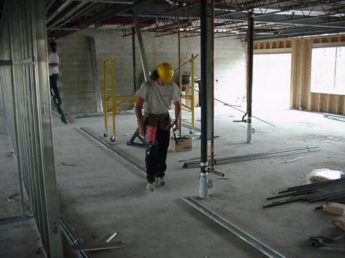 112-WorkerWithToolBuildingWall-09-02-04