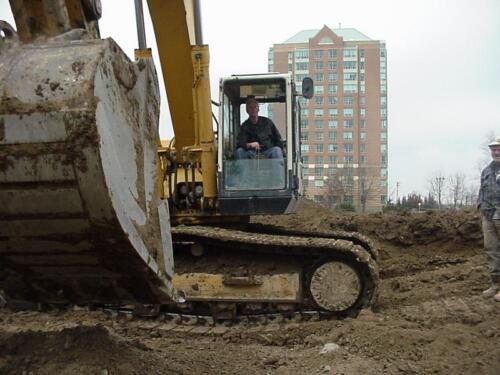 16-General Manager at controls of earthmover11-22-03