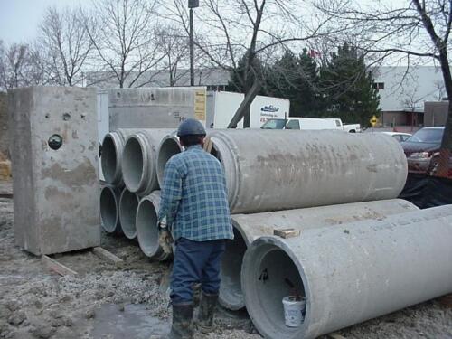 26-ManWithSewerPipes-12-12-03